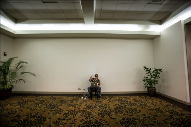 ALONE AGAIN Civil Beat Chief Political Reporter Chad Blair sits alone once again as he covered the Democratic Party Unity Breakfast. Give him a chair, a cup of coffee and an outlet and he's happy.