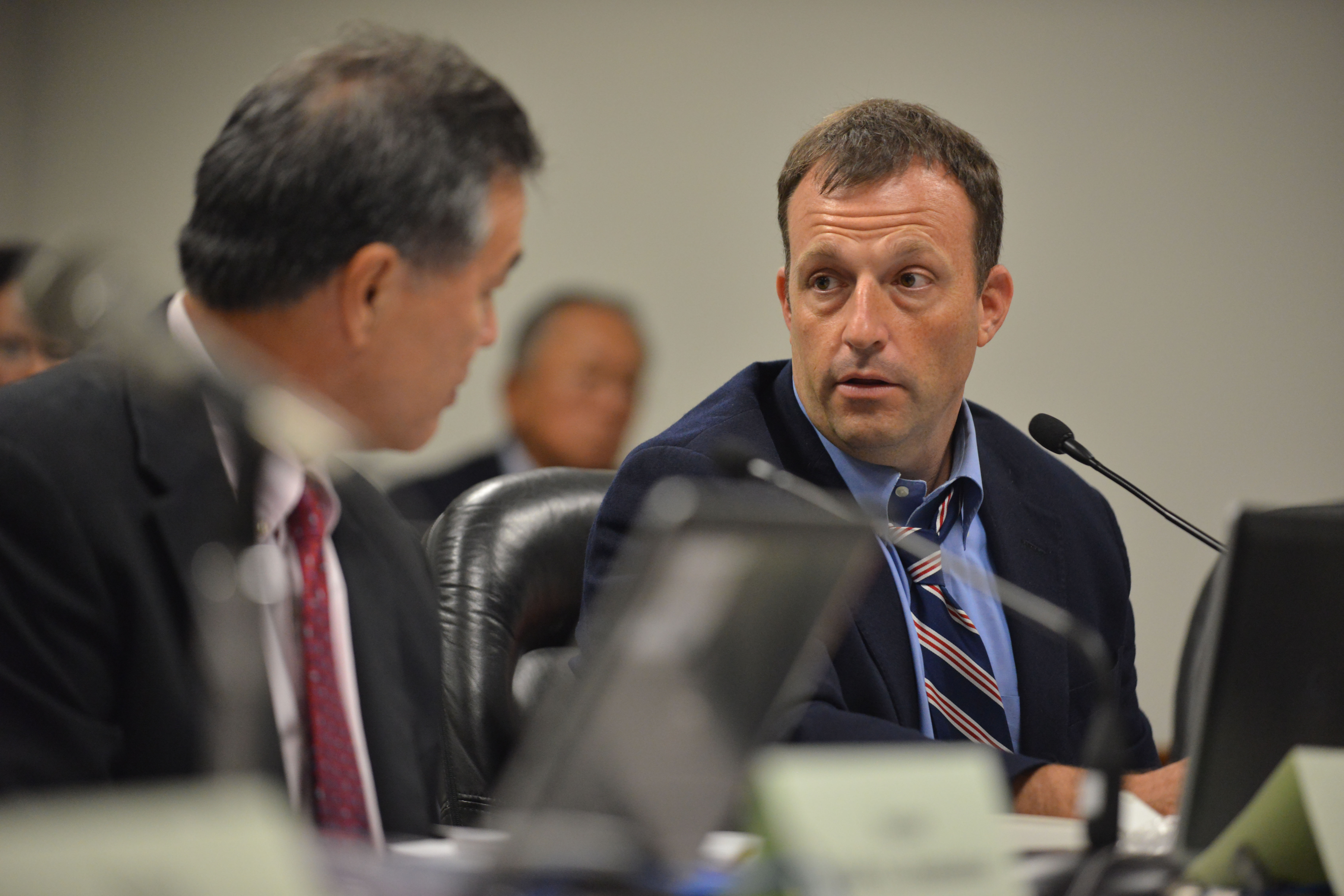 Right, Special Investigative Committee on the Hawaii State Hospital Senator Josh Green, Co-Chair speaks to left Co-Chair Senator Clayton Hee during a meeting on October 22, 2014. 12pm. photograph by Cory Lum.