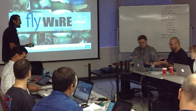 Jacob Issac-Lowry, founder of Flywire, listens to advice and feedback on his startup’s strategy during an XLR8UH workshop.