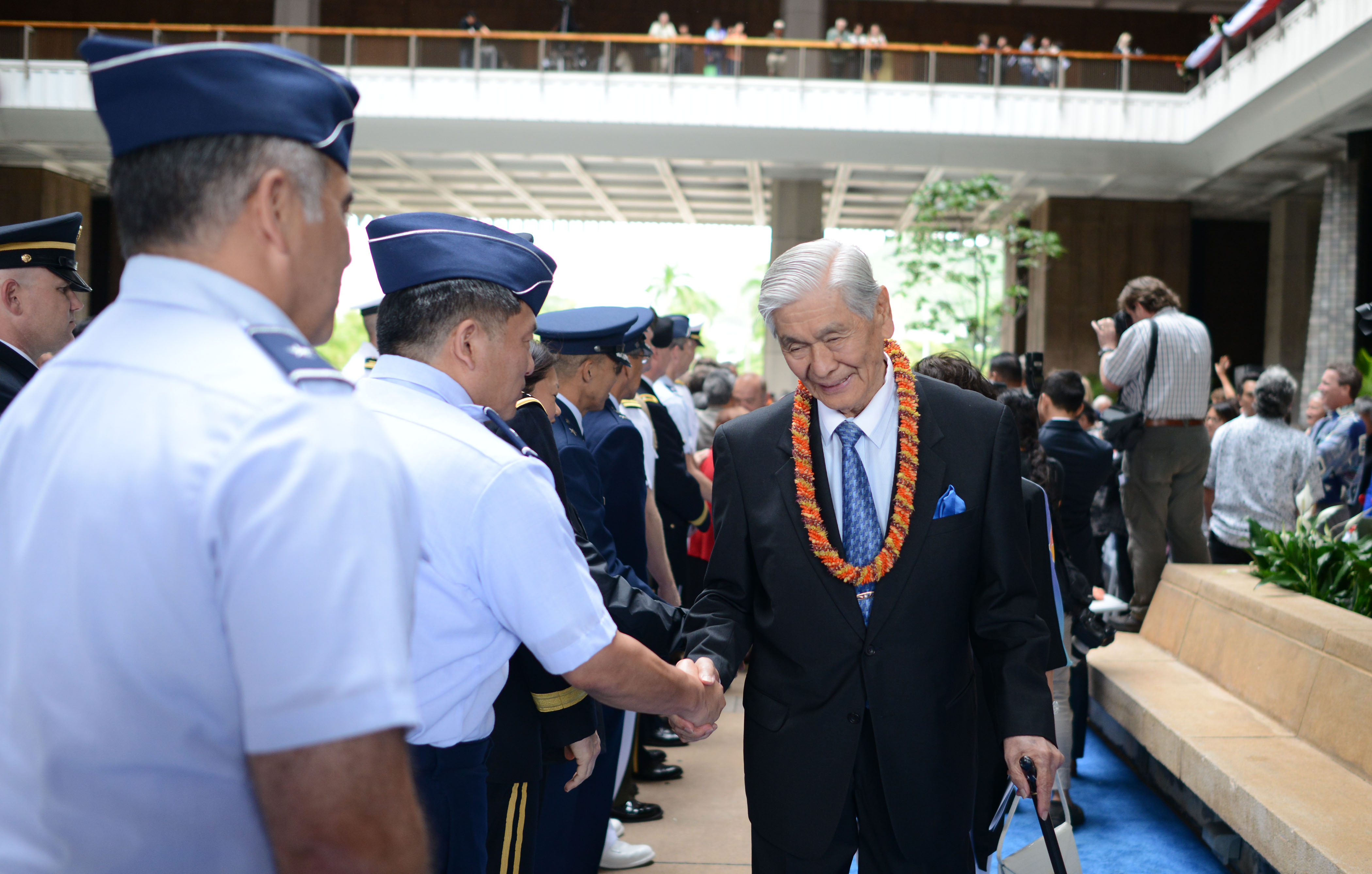 Governor George Ariyoshi greets service men and women at the end of the inauguration ceremonies as he leaves the rotunda area of the Capitol. 1 dec 2014. photo Cory LUm
