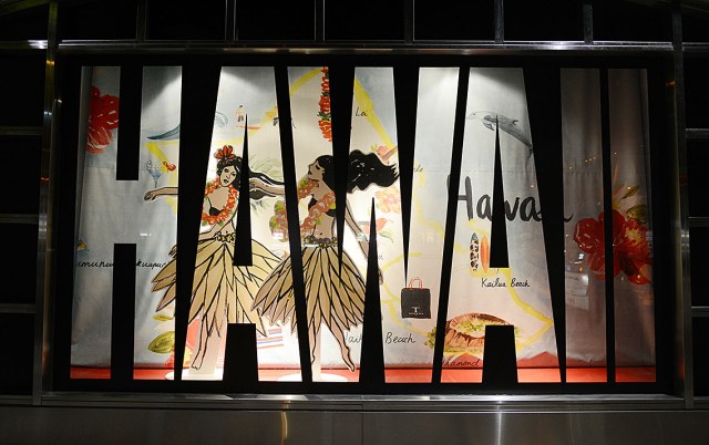 DFS Galleria Waikiki life-sized hula dancer cutouts in a display along Royal Hawaiian Avenue. 9 jan 2015. photograph Cory Lum/Civil Beat