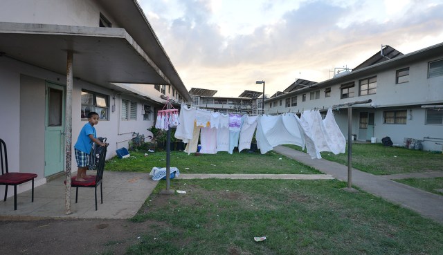 Kids play inside Mayor Wright public housing for Anita story. Didn’t notice much neglect or damage. After speaking to several residents most declined to let me check out inside their residences. 31 jan 2015. photograph Cory Lum/Civil Beat