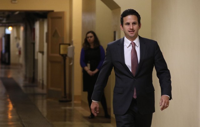 Senator Brian Schatz heads down the corridor basement on his way to the Capitol Subway system. 23 feb 2015. photograph Cory Lum/Civil Beat