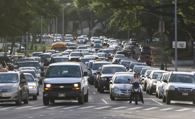 Moped rider among vehicular traffic along the morning commute on Beretania Street near the Punchbowl street intersection. 3 march 2015 photograph Cory Lum/Civil Beat