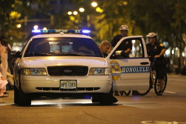 Honolulu Police Deparment officers along Kalakaua Avenue duirng the Honolulu Festival parade. 8 march 2015. photograph Cory Lum/Civil Beat