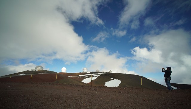 Visitor makes a photograph of the various telescopes on the summit of Mauna Kea. 9 april 2015. photograph Cory Lum/Civil Beat