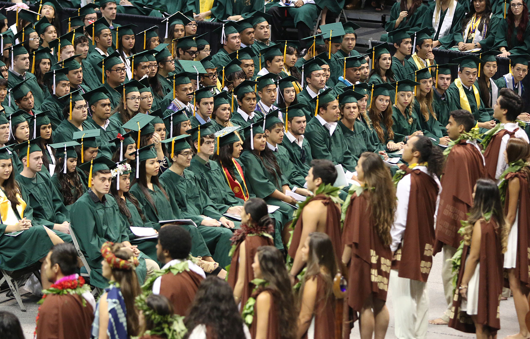 Students from the Hawai’inuiakea School of Hawaiian Knowledge perform an oli at the Undergraduat Degree Ceremony held at Stand Sheriff Center. 16 may 2015.  photograph by Cory Lum/Civil Beat