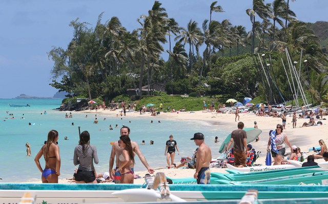 Shores of Lanikai Beach with visitors enjoying the azure blue waters and powdered sand. 2 june 2015. photograph Cory Lum/Civil Beat