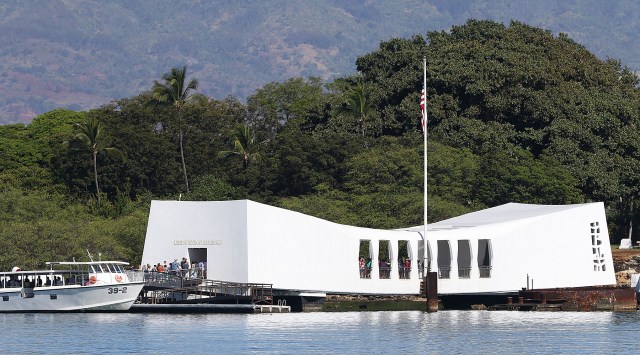 Visitors arrive onboard the USS Arizona Memorial with a clear view of the Waianae Mountain range as a backdrop. 5 june 2015. photograph Cory Lum/Civil Beat