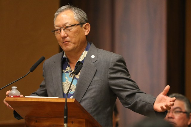 Honolulu City Managing Director Roy Amemiya gestures while answering Council Member Ann Kobayashi's questions. 2 sept 2015. photograph Cory Lum/Civil Beat