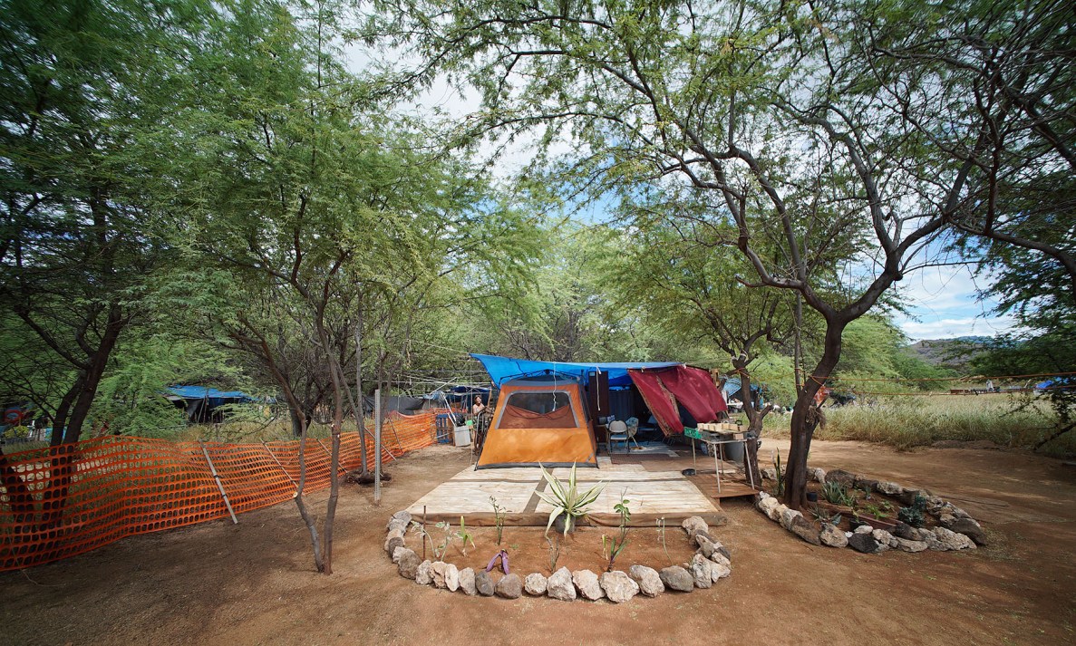 The residents of this camp moved into the site just two months ago. They've spent hundreds of hours making it a home, including adding a bathroom area.