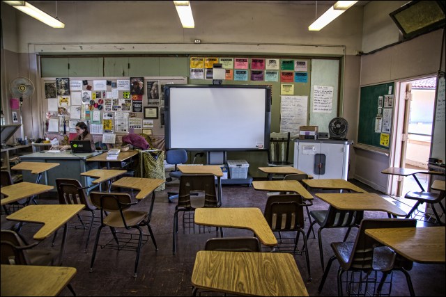 McKinley High School journalism teacher Cindy Reves prepares for her class. 