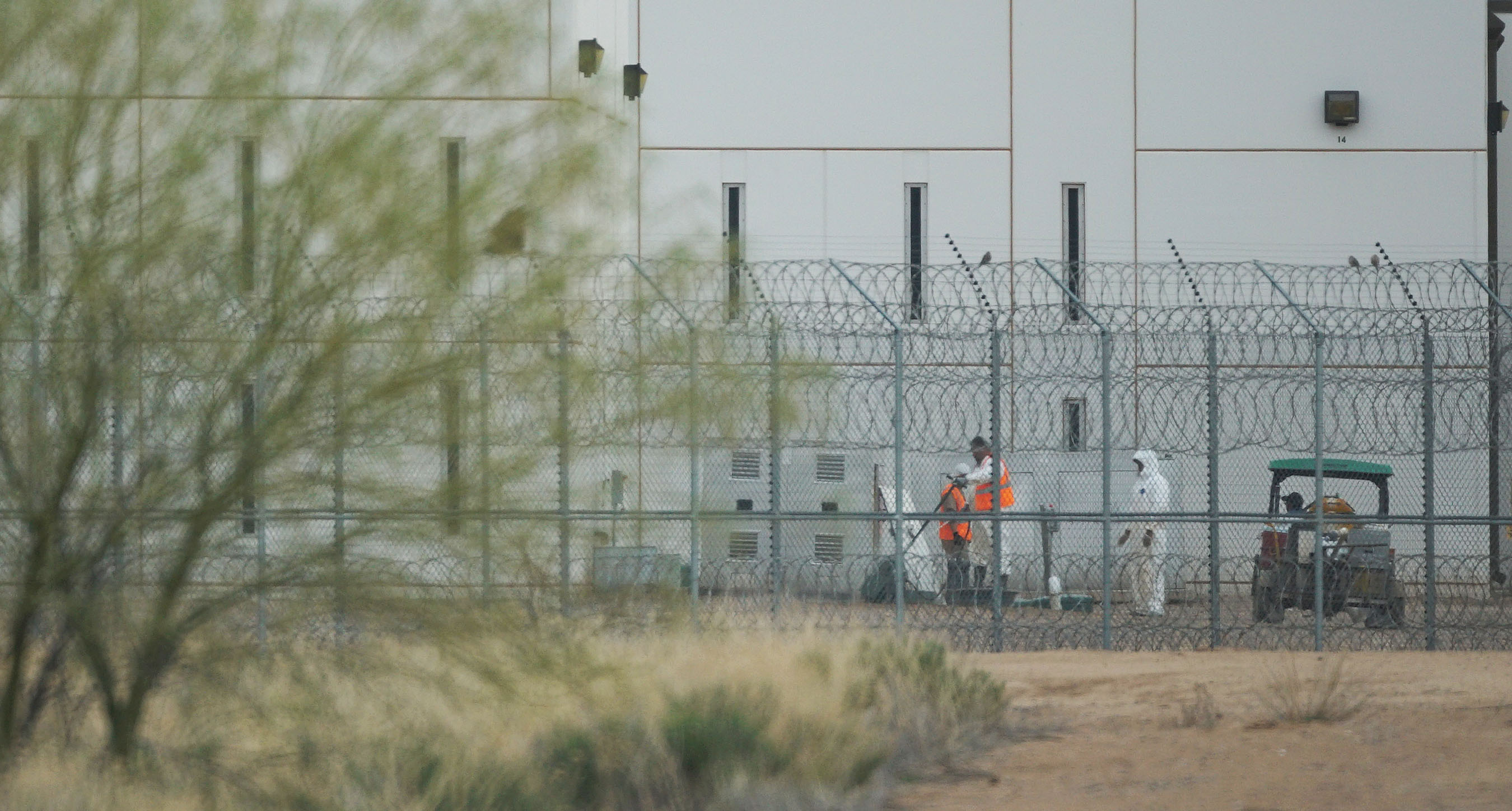 Saguaro Correctional Facility. People walking around inside of fences. Eloy, Arizona 6 march 2016. photograph Cory Lum/Civil Beat