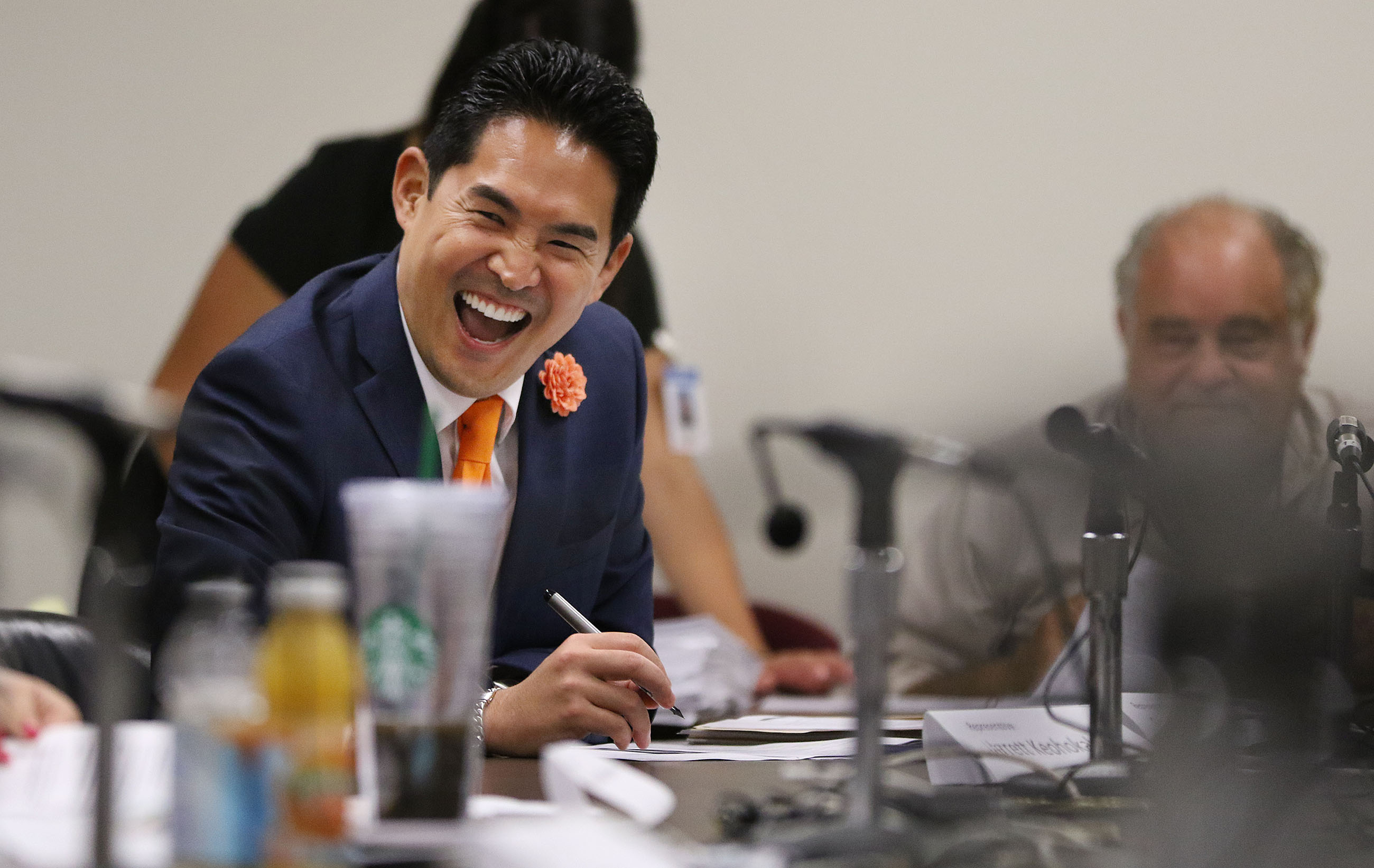 Rep Scott Nishimoto laughs during a light moment during conference committee. 215pm agenda. 26 april 2016.