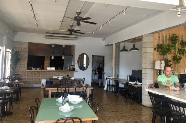 Kenney sits at Mud Hen Water. Its design integrates breeze blocks, common in local architecture, and its wood flooring was taken from the Honolulu Advertiser building in 1909.