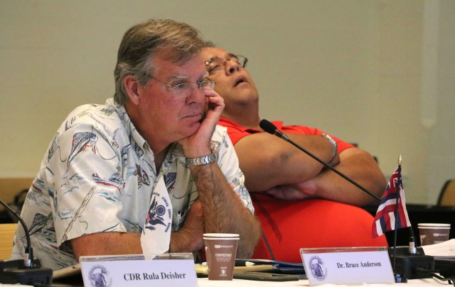 Bruce Anderson, left, administrator of the Hawaii Division of Aquatic Resources, listens next to Richard Seman, secretary of the Commonwealth of the Northern Mariana Islands Department of Land and Natural Resources, during a meeting of the Western Pacific Regional Fishery Management Council, Oct. 13, 2016, in Honolulu. 