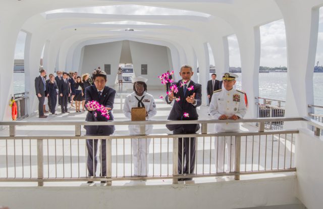 20161227-4666 CTY OBAMA ABE MEET ARIZONAPHOTO BY DENNIS ODAPresident Obama met with Japanese Prime Minister Shinzo Abe inside the Arizona Memorial to lay wreaths (at Joint Base Pearl Harbor-Hickam in Honolulu, Hawaii). After laying wreaths, they left the inner chamber and went to the "well" over the ship and threw orchids into the water. (l-r) Abe, YN2 (yeoman 2nd class) Mihelle Wrabley, Obama and Admiral Harry Harris. The meeting will be an opportunity for the two leaders to review our joint efforts over the past four years to strengthen the U.S.-Japan alliance, including our close cooperation on a number of security, economic, and global challenges. The President will also accompany Prime Minister Abe to the USS Arizona Memorial at Pearl Harbor to honor those killed. The two leadersÕ visit will showcase the power of reconciliation that has turned former adversaries into the closest of allies, united by common interests and shared values. PHOTO BY DENNIS ODA. DEC. 27, 2016. Pearl Harbor-Hickam in Honolulu, Hawaii). The meeting will be an opportunity for the two leaders to review our joint efforts over the past four years to strengthen the U.S.-Japan alliance, including our close cooperation on a number of security, economic, and global challenges. The President will also accompany Prime Minister Abe to the USS Arizona Memorial at Pearl Harbor to honor those killed. The two leadersÕ visit will showcase the power of reconciliation that has turned former adversaries into the closest of allies, united by common interests and shared values. PHOTO BY DENNIS ODA. DEC. 27, 2016.