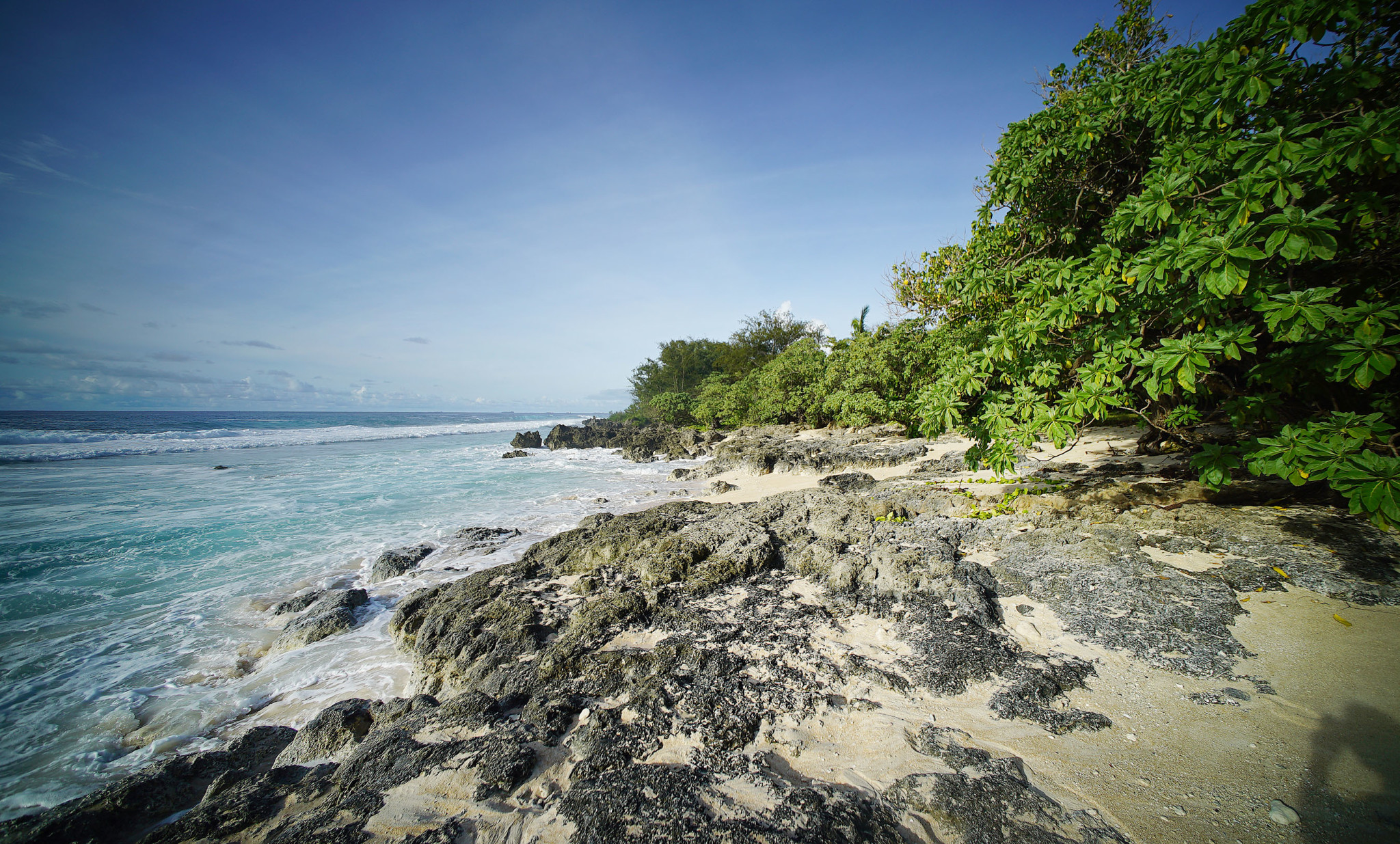 Marianas Tinian Beach with rocky shoreline. This beach area was down from site where drone got stuck in the trees. 28 aug 2016