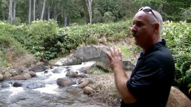 Landis Ignacio of the Kekaha Agriculture Association explains the significance of the Kokee stream diversion in the Kokee Ditch system.