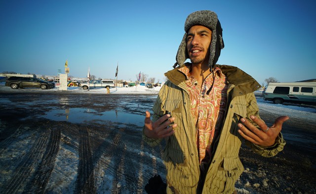 Marine veteran Leomana Turalde from Keaukeaha, Hawaii island shows off his aloha shirt under his jacket. Leomana brought an aloha shirt for each day his visiting Standing Rock.
