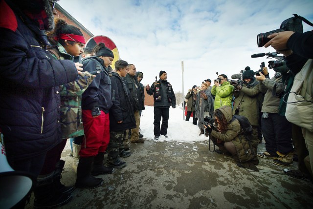 Andre Perez introduces Standing Rock demonstrators fronting the Mandan Police Dept. Mandan, North Dakota. 2 dec 2016
