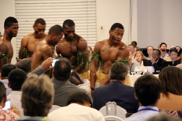 Fijians carry a pig during the opening of the Western and Central Pacific Fisheries Commission meeting Monday at the Sheraton Fiji Resort.