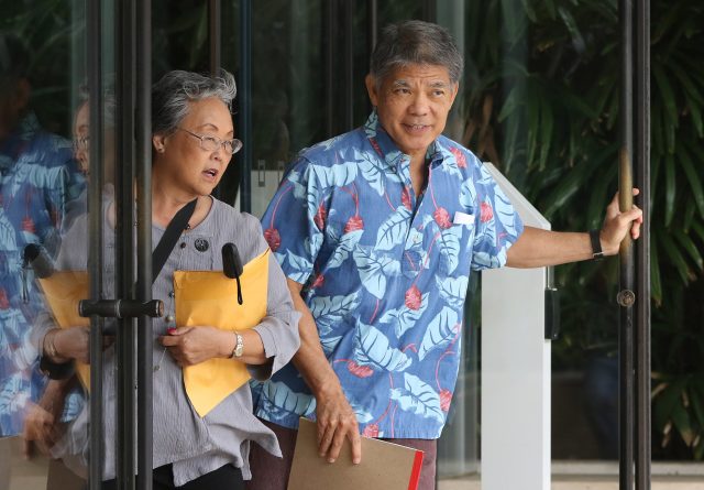 City Attorney Paul Aoki with left, Wendy Imamura leave US District Court.