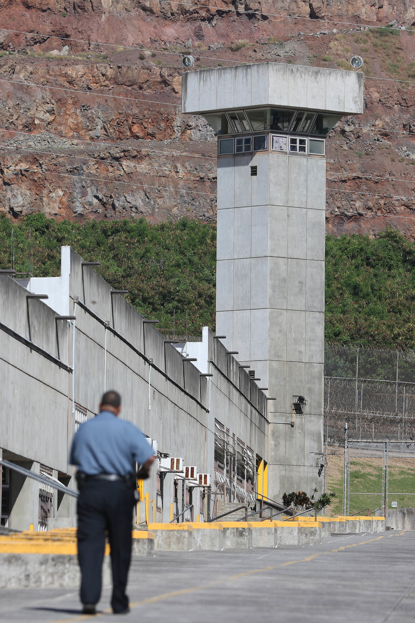 Halawa prison guard walks down 'Main Street' as inmates traverse from modules to modules. file photograph from 2015 December.