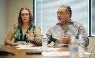 Public Safety Director Noland Espinda at office meeting with left Toni Schwartz.