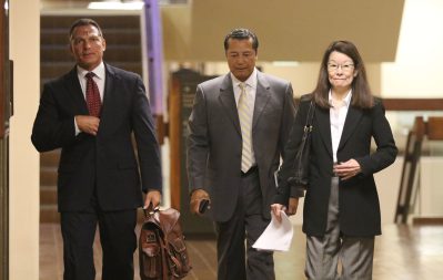 Right, Deputy Prosecutor Jan Futa with center, Attorney William Harrison walk to Judge Trader's courtroom for Grube case.