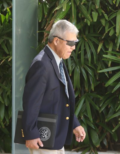 Prosecutor Keith Kaneshiro leaves District Court.