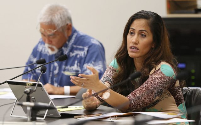 Representative Andria Tupuola asks some questions during 'Briefing on homeless solutions' held at the Capitol room 329.