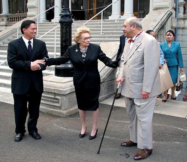 In this Feb. 4, 2010 photo provided by the Iolani Palace, Abigail Kawananakoa, center, meets the King of Tonga, right, as Executive Director Kippen de Alba Chu, left, looks on outside the palace in Honolulu. The 91-year-old Native Hawaiian heiress, Kawananakoa, is fighting her former lawyer over control of her $215 million fortune. Many Native Hawaiians consider Kawananakoa to be the last Hawaiian princess, a tenuous link to when Hawaii was ruled by a royal family. (Douglas Askman/Iolani Palace via AP)