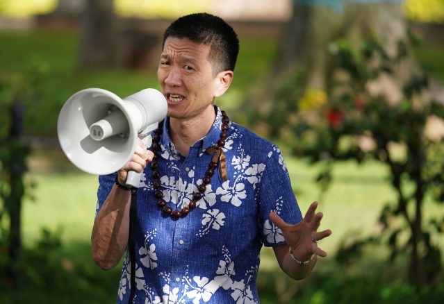 Lieutenant Governor Doug Chin speaks at a rally/demonstration along Ala Moana Boulevard fronting the Federal Building speaking out against Tuesday's 5 to 4 supreme court vote upholding President Trump's travel ban against foreign travelers entering the US.