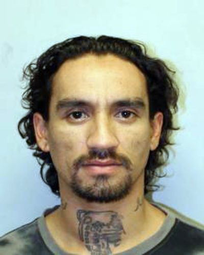 This undated photo provided by the Hawaii Police Department shows Justin Waiki. A police officer on Hawaii's Big Island died after a shooting during a traffic stop Tuesday, July 17, 2018, and a manhunt is underway for suspect Waiki. (Hawaii Police Department via AP)