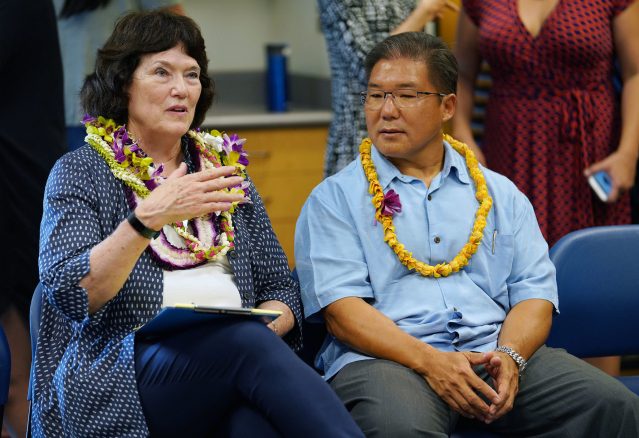 Public sit in a circle during a meet/greet with Board of Education board member Dwight Takeno and left, Chair Catherine Payne at Manoa Library.