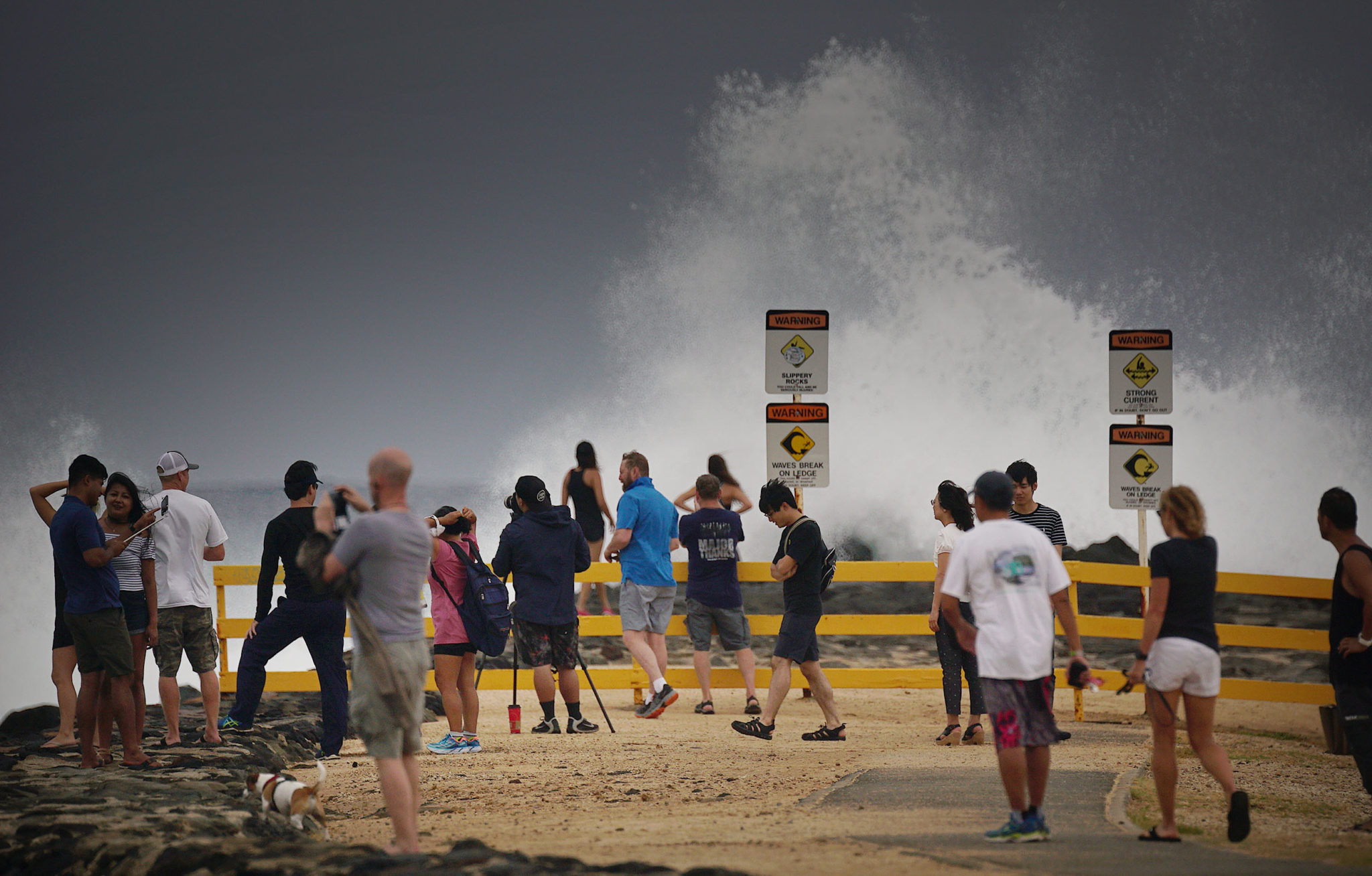 People watch waves at Magic Island near Ala Moana as Hurricane Lane heads north towards Oahu.