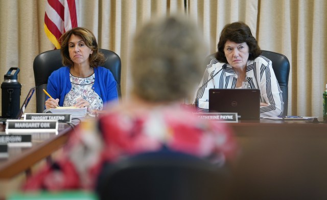 DOE Superintendent Kishimoto Chair Catherine Payne during board meeting.