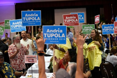 Supporters of republican candidate for Governor Andria Tupola hold signs as support in Honolulu, Hawai'i on Tuesday November 6th, 2018.CB Photo/Ronen Zilberman