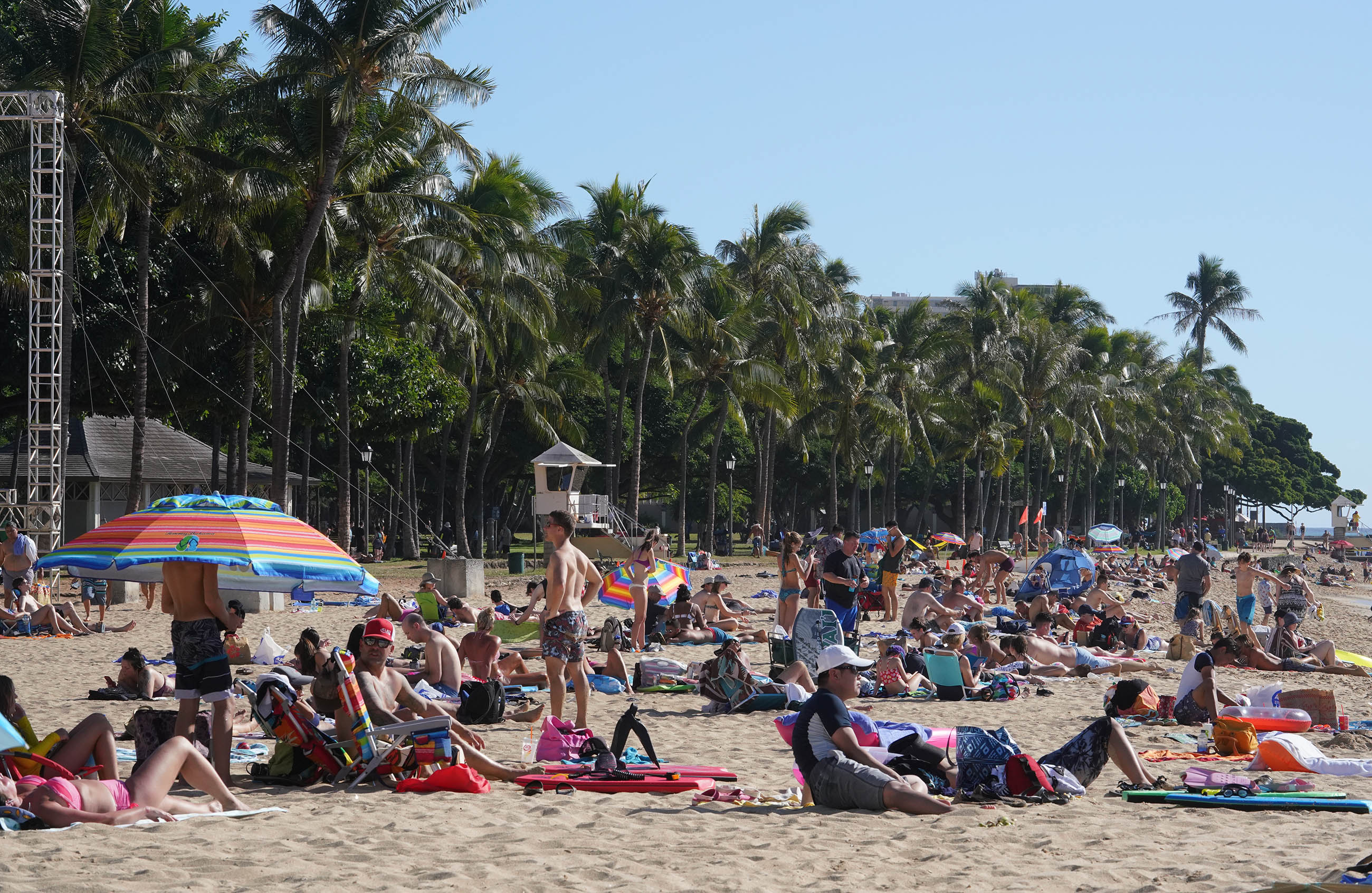 Visitors at Waikiki Beach near the Kapahulu groin.
