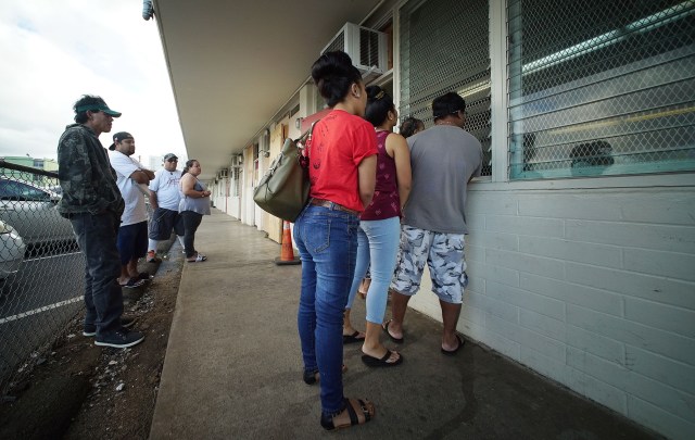 People overflow outside the We Are Oceania offices. Anita's story on health benefits deadline for COFA residents.