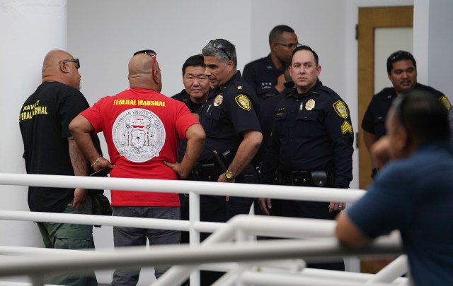 Federal Marshal Polynesian Kingdom of Atooi at Office of Hawaiian Affairs OHA with Honolulu Police Dept officers on the second floor near the entrance of OHA.