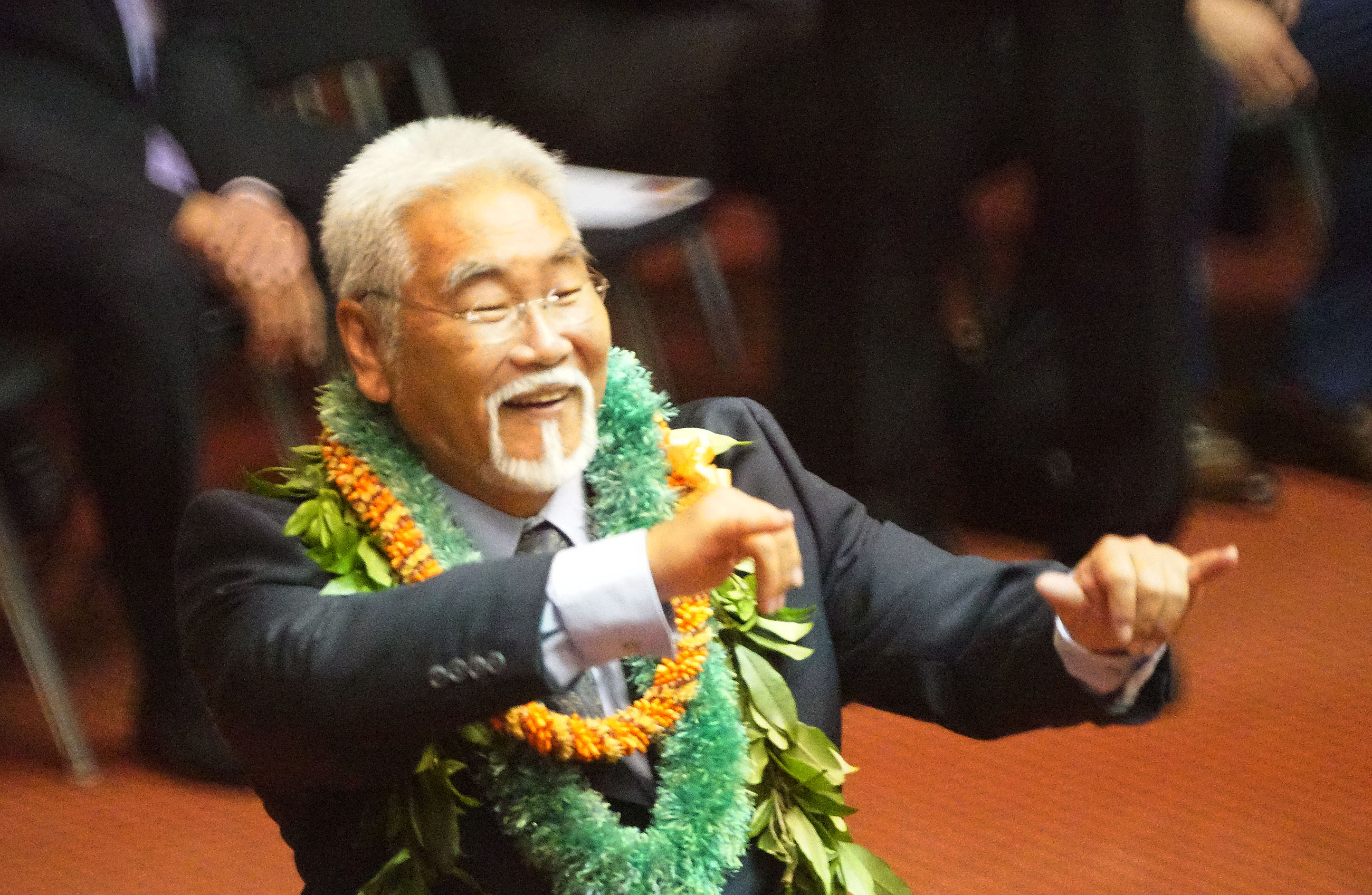 Rep Sam Kong fires off a shaka as he is introduced on the entrance of lawmakers on 2019 opening day of the legislature.