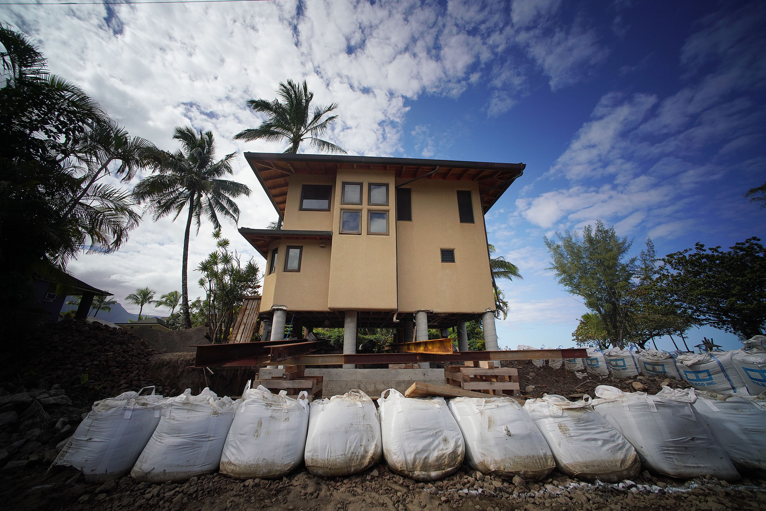 Home propped up with large I beans along Weke Road homes damaged Kauai Flooding 2018.