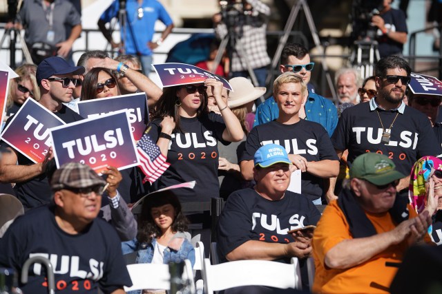 Congresswoman Tulsi Gabbard announces her run for president with supporters holding signs at the Hilton Hawaiian Village.
