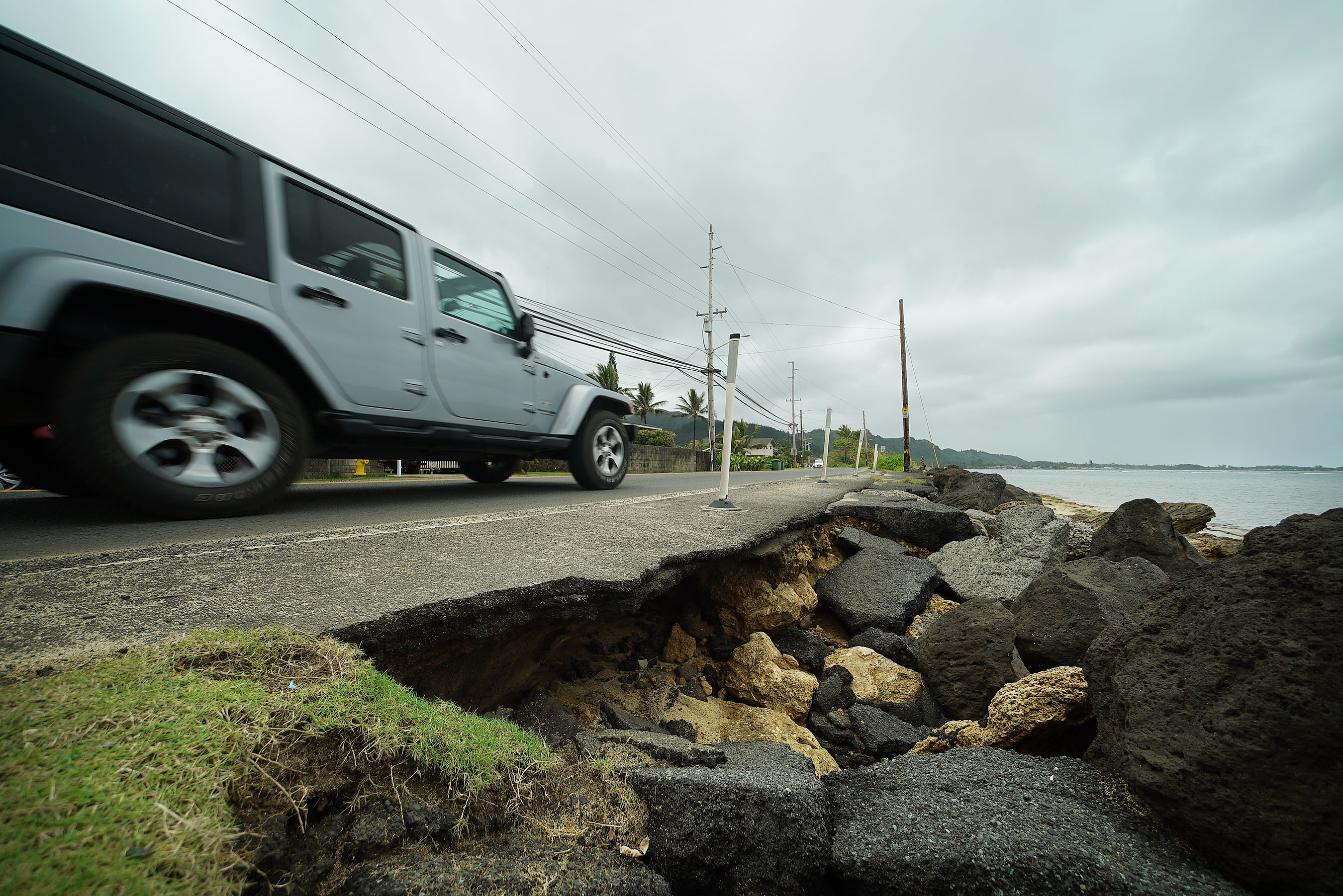 Kaawa Punaluu Kamehameha Hwy boulders and damaged road. Climate Change