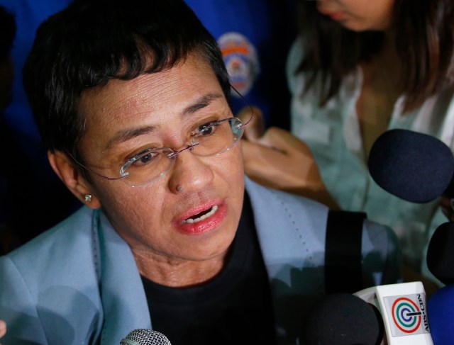 Maria Ressa, the award-winning head of a Philippine online news site Rappler, talks to the media after posting bail at a Regional Trial Court following an overnight arrest by National Bureau of Investigation agents on a libel case Thursday, Feb. 14, 2019 in Manila, Philippines. Ressa was freed on bail Thursday after her arrest in a libel case. (AP Photo/Bullit Marquez)