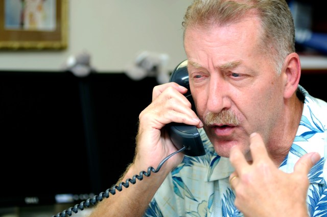 FILE - This March 11, 2011 file photo shows then-Honolulu Mayor Peter Carlisle speaking on a telephone as he worked from the Department of Emergency Management in Honolulu. Carlisle says a growing corruption investigation has made him want to return to his old job as the city's top prosecutor. Carlisle tells The Associated Press, Wednesday, April 10, 2019 he's ready to run against Honolulu Prosecuting Attorney Keith Kaneshiro, who took a leave of absence after receiving a letter informing him he's a target in a federal investigation. (AP Photo/Rebecca Breyer)