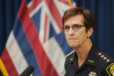 Honolulu Police Dept Chief Susan Ballard listens to media questions during press conference on domestic violence.