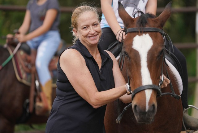 Kim Hollandsworth works with horses at Waimanalo.